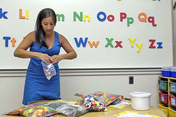 Nicole Fischette readies her pre-K classroom at Tuckahoe School on Monday.  DANA SHAW