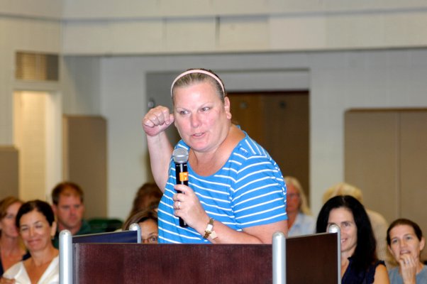 Tuckahoe first grade teacher Linda O'Brien addresses the board at Thursday's meeting.  DANA SHAW