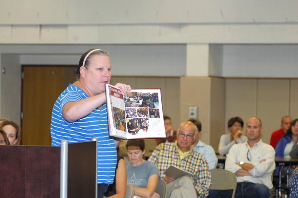 Tuckahoe first grade teacher Linda O'Brien addresses the board at Thursday's meeting.  DANA SHAW
