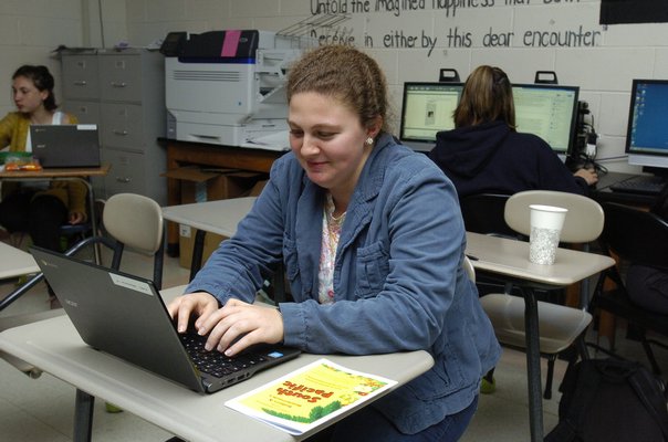 Gabriella Lobue, a senior, works on an article for The Tide.