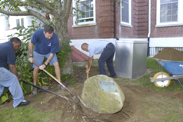 A crew from Southampton Town works to unearth the time capsule.  DANA SHAW
