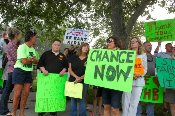 About 65 people protested in front of the Westhampton Beach Middle School on Wednesday morning in support of Aiden Killoran.  DANA SHAW