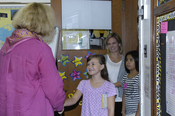Catherine Arcure of Manhattan Manners welcomes students to the class.  DANA SHAW