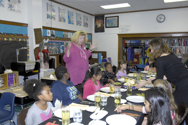 Catherine Arcure of Manhattan Manners  goes over table etiquette.   DANA SHAW