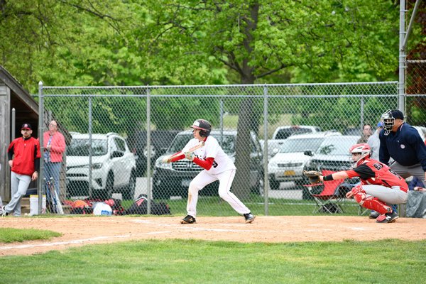 Sam Warne looks to drop a bunt down for the Whalers.
