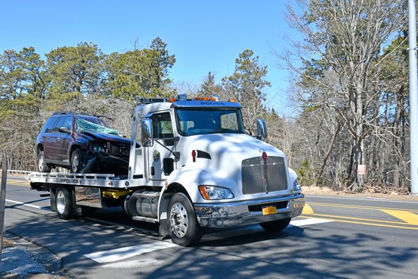 A Chevrolet TrailBlazer involved in a fatal collision on Flanders Road early Tuesday morning is towed from the scene.  DANA SHAW