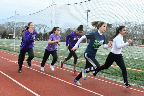 The Lady Baymen get some running in during practice on Monday. DANA SHAW