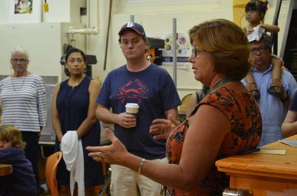 Technology and environmental deisgn teacher Judiann Carmack-Fayyaz explains space issues students face in the technology classroom. KELLY ZEGERS