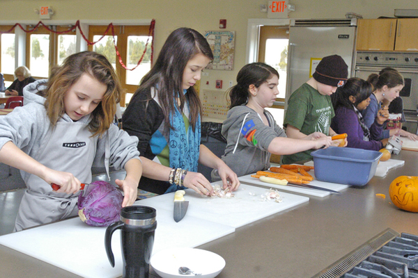 Students in Jeff’s Kitchen at the Hayground School prepare a meal.
