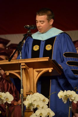 Southampton High School Principal Dr. Brian Zahn addresses the crowd at the 2014 graduation ceremony on Friday night. By Erin McKinley