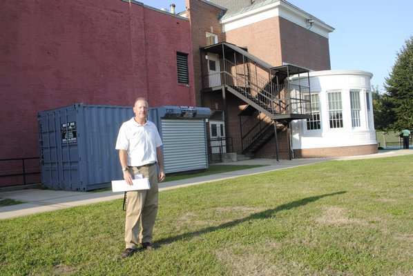 Robert Hauser, assistant superintendent of finance and facilities at Bridgehampton School, reviews plans for his school's construction project. AMANDA BERNOCCO