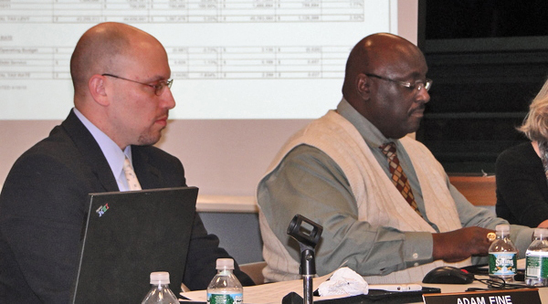 High school Principal Adam Fine and School Board member the Reverend Marvin Dozier.
