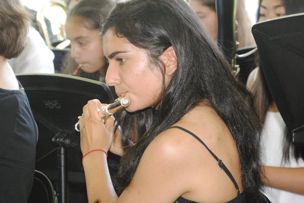 Annabelle Dominguez plays her flute during the Hampton Bays Class of 2017 graduation on Saturday afternoon. AMANDA BERNOCCO