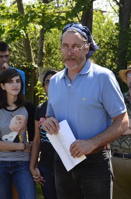 Jok Kommer, head of the CURE club at Westhampton Beach High School, leads the Arbor Day celebration on Friday. BY ERIN MCKINLEY