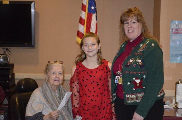 Aurora Blowes, middle, with Susan McCarthy, president of the Westhampton Care Center's Resident Council, left, and Kelly Brady, adminstrator of the care center, right. ANISAH ABDULLAH