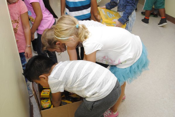 Students in Kristin Webber's second grade class at Hampton Bays Elementary School are donating crayons to a school in Texas that was devestated by Hurricane Harvey. AMANDA BERNOCCO