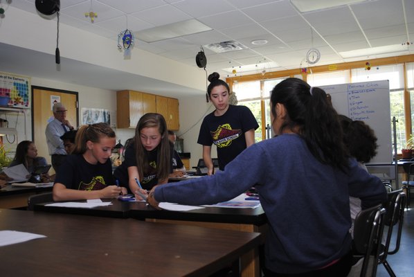 The seventh grade students in Dennis Schleider's class participated in an eMission project, where they had to work together to save the residents of the island of Montserrat from a volcanic eruption in the face of an approaching hurricane. AMANDA BERNOCCO