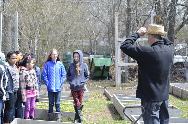 Tukcahoe fifth graders planted potatoes in the school's community garden last week. BY ERIN MCKINLEY