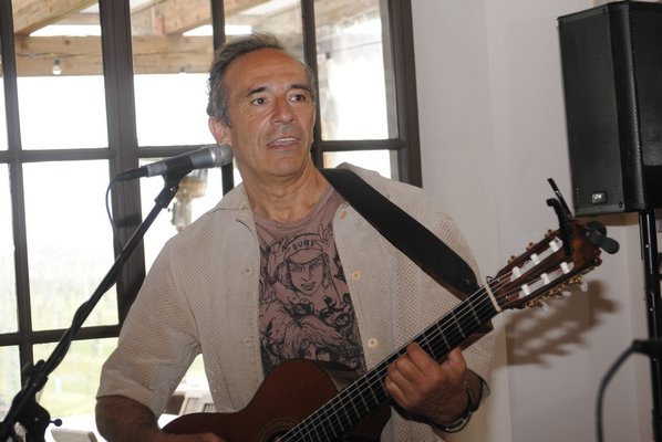 Alfredo Merat, a musician living in Springs, will play his guitar at the vigil in Good Ground Park in Hampton Bays on Saturday. AMANDA BERNOCCO