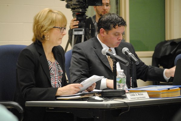 Linda Weiss, assistant superintendent for personnel, and Richard Snyder, assistant superintendent for business, at Wednesday night's Board of Education meeting. AMANDA BERNOCCO