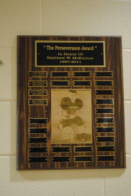 The names of the recipients of the Perseverance Award, in memory of Matthew McKinnon, are displayed on a plaque outside the Hampton Bays Middle School gymnasium. AMANDA BERNOCCO