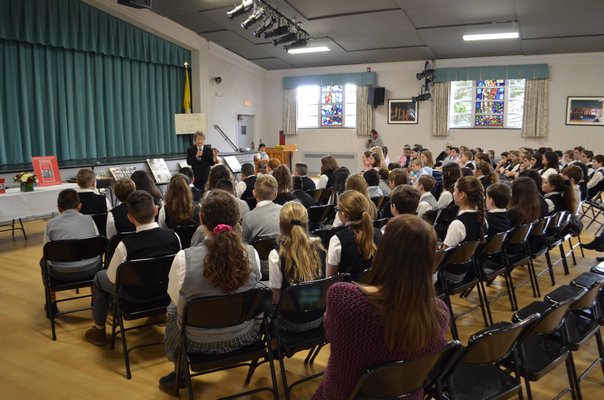 Sixth-, seventh- and eighth-grade students from Our Lady of the Hamptons School listened to Bozenna Urbanowicz Gilbride speak about her experience living through the Holocaust. ANISAH ABDULLAH