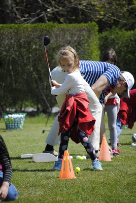 Morgan Mcarty, a kindergartener, takes a swing at Quogue Field Club. AMANDA BERNOCCO