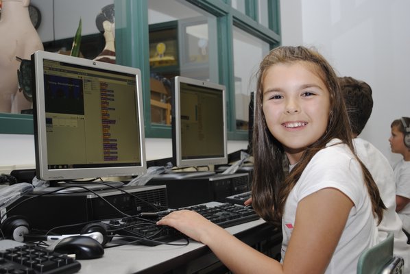 Julia Sobhani, 9, learns how to do computer coding during a club after school at East Quogue Elementary. AMANDA BERNOCCO