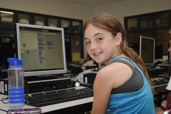 Kara Flynn, 9, learns how to do computer coding during a club after school at East Quogue Elementary. AMANDA BERNOCCO