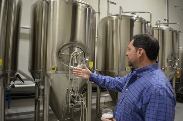 Westhampton Beach Brewing Company co-owner Brian Sckipp explains how their space at Hampton Business District allows them to do all aspects of business operations. ANISAH ABDULLAH