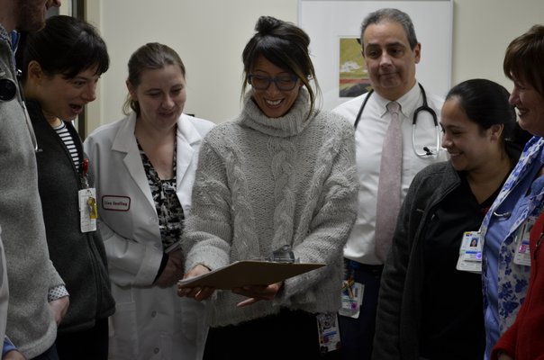 Westhampton Primary Care Center staff having their daily huddle in the morning. ANISAH ABDULLAH
