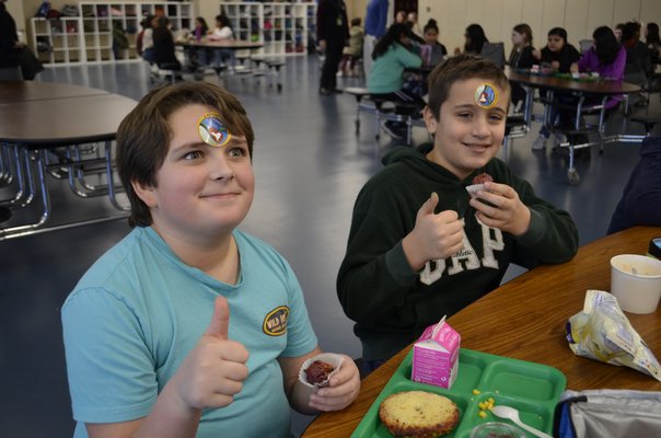 Sixth graders at Southampton Intermediate School enjoying the "red velvet" beet muffins. ANISAH ABDULLAH