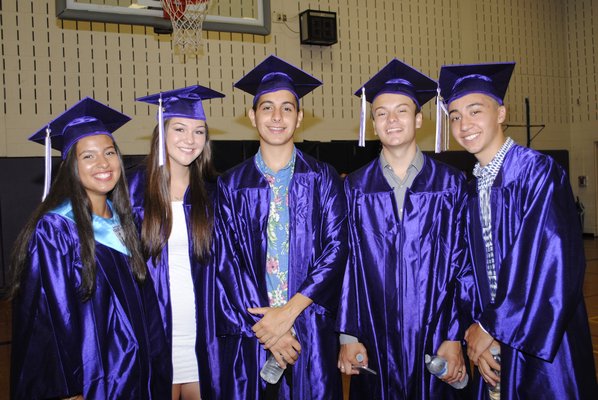 From left: Tiffany Brenes, Emily Lowry, Dario Vasquez, Miguel Flores and Gabriel Guambana graduated on Saturday afternoon. AMANDA BERNOCCO