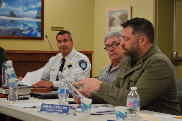 Village Board member Brian Tymann speaking at the Village Board work session on February 20. Also pictured are Building and Zoning Administrator Paul Houlihan and Police Chief Trevor Gonce. ANISAH ABDULLAH