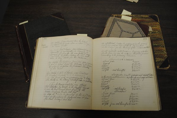 A book of handwritten Hampton Bays Board of Education minutes from the early 1900s. AMANDA BERNOCCO