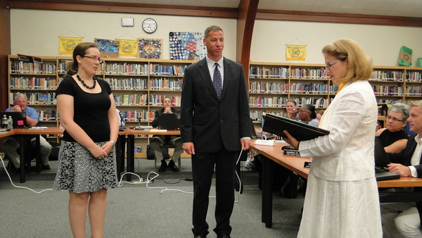 Southampton School District Clerk Mary Pontieri swears in new School Board members Amy Pierson and Nicholas Palumbo on Tuesday, July 12.