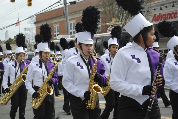 Students from the Hampton Bays High School band march during the St. Patrick's Day parade. AMANDA BERNOCCO