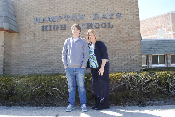 Jared Strecker, a Hampton Bays High School sophomore, and Denise Sullivan, assistant superintendent of curriculum and instruction, outside the high school. AMANDA BERNOCCO