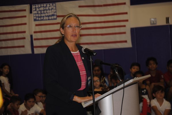 Suffolk Legislature Bridget Fleming remembers the terrorist attacks on September 11, 2001, during a flag ceremony at Hampton Bays Elementary School. AMANDA BERNOCCO