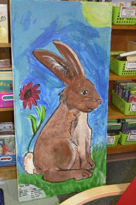 Westhampton Beach Elementary School fifth graders helped paint ceiling tiles with native Long Island animals as part of a beautification project. BY ERIN MCKINLEY