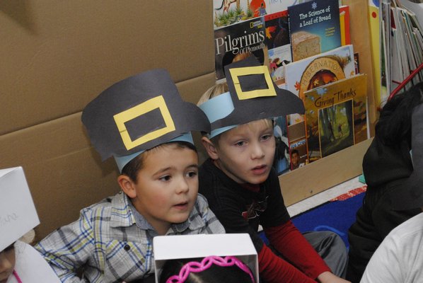 J.J. Hillen, left, and Henry Rose learn about Thanksgiving at Hampton Bays Elementary School. AMANDA BERNOCCO