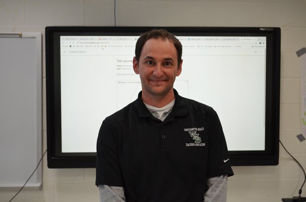 Westhampton Beach High School math teacher Nick Kochis recently received an award for integrating technology into the classroom. ANISAH ABDULLAH