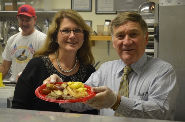 District Clerk Linda Springer and Superintendent Joseph Chris Dyer serve breakfast to local veterans on Monday morning at the Tuckahoe School. BY ERIN MCKINLEY