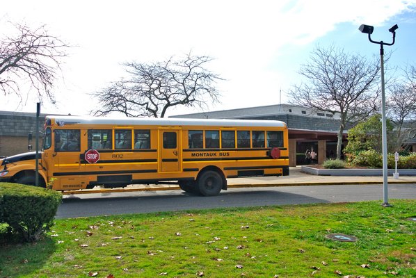 Students return to Hampton Bays High School afteran evacuation due to a smell of gas.  DANA SHAW