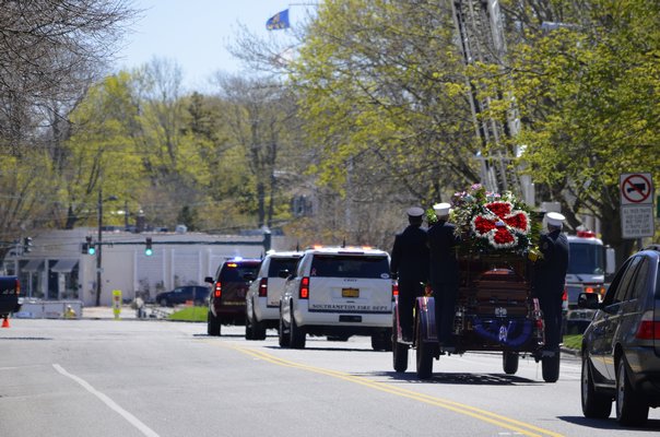 Edward Corrigan's funeral procession went to the Sacred Hearts Cemetery in Southampton. ANISAH ABDULLAH