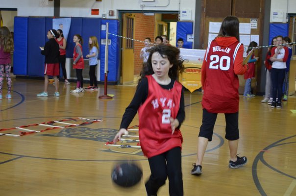 Fifth-grader Sarah Brosnan participated in the annual "Hoops for Heart" fundraiser at East Quogue Elementary School on Friday. ALEXA GORMAN