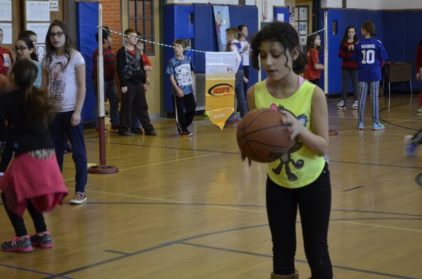 Fifth-grader Nataly Castillo participated in the annual "Hoops for Heart" fundraiser at East Quogue Elementary School on Friday. ALEXA GORMAN