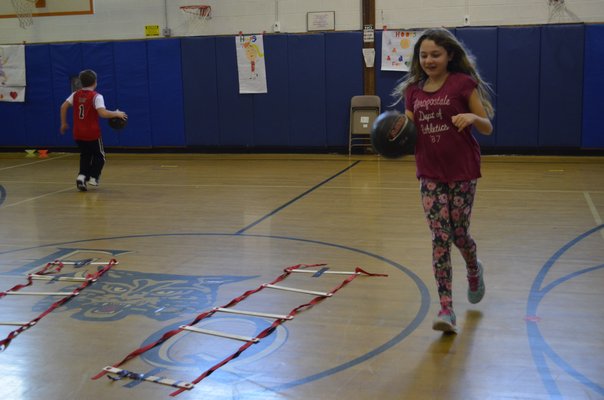 Fifth-grader Ciara Herbert participated in the annual "Hoops for Heart" fundraiser at East Quogue Elementary School on Friday. ALEXA GORMAN