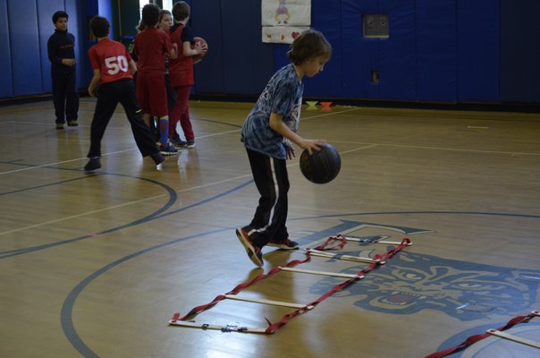 Fifth-grader Sean Tyrie participated in the annual "Hoops for Heart" fundraiser at East Quogue Elementary School on Friday. ALEXA GORMAN