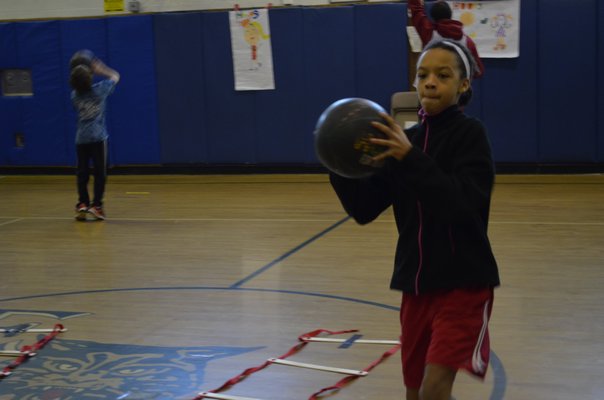 Fifth-grader Jahneese Brathwaite participated in the annual "Hoops for Heart" fundraiser at East Quogue Elementary School on Friday. ALEXA GORMAN